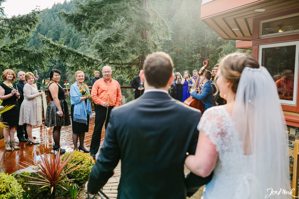Microwedding ceremony. Guests witing, couple enters together
