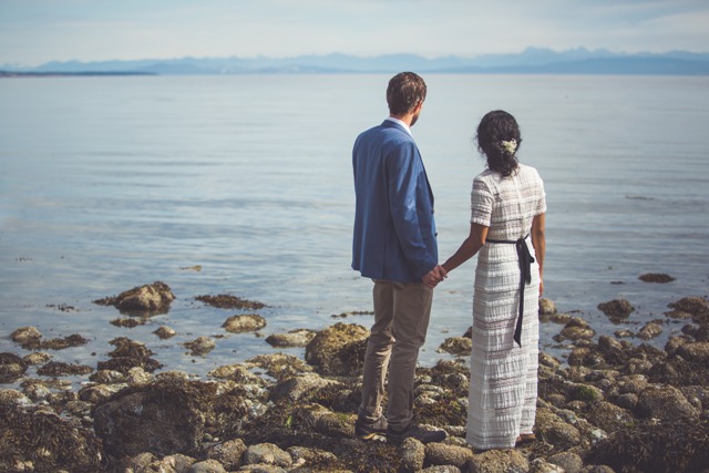 Elopement Vancouver Island couple stading at the water's edge