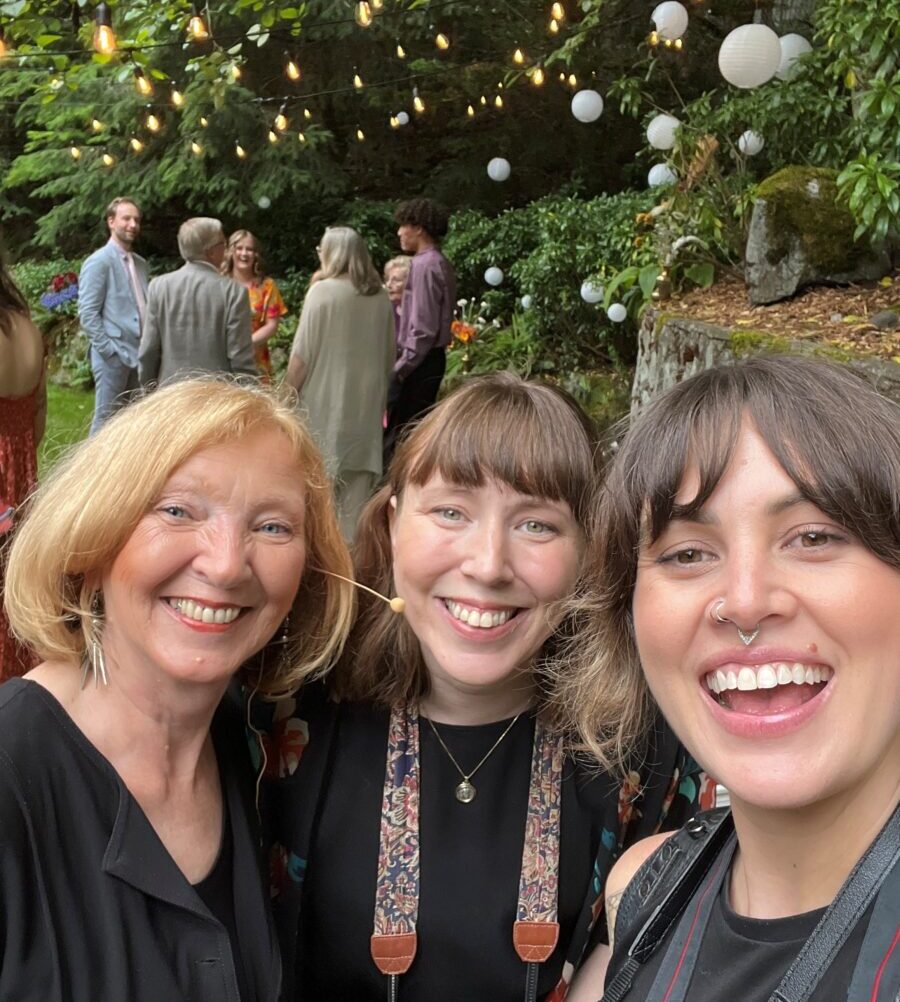 Wedding celebrant with guests and photographers at outdoor ceremony in Victoria BC